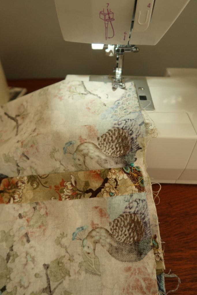 picture of fabric under sewing machine footer